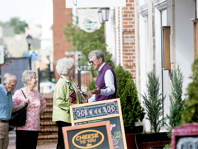 Two couples outside downtown restaurant