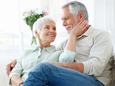 Couple seated embracing