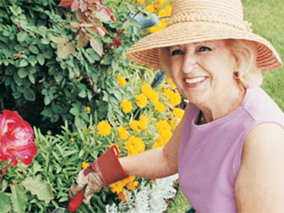 Woman-tending-flower-garden