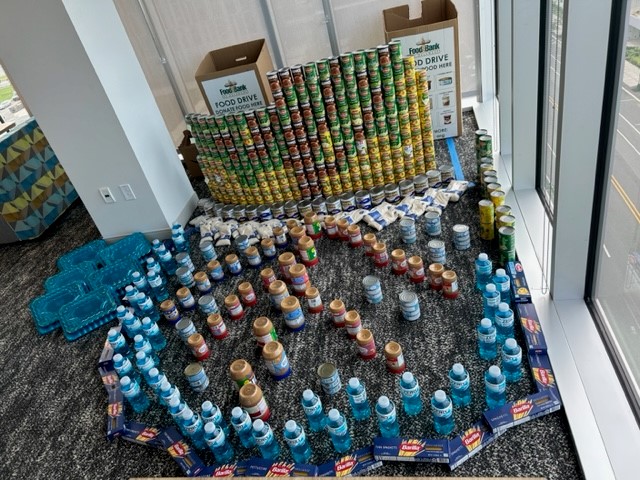 Canned foods stacked to look like tree and reflection